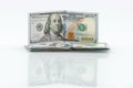 Stack of dollars with reflection. One hundred USA dollar banknotes. Concept of increasing or making a profit