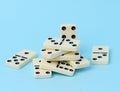 A stack of dominoes on a blue background, an intellectual game