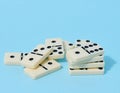 A stack of dominoes on a blue background, an intellectual game