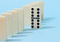 A stack of dominoes on a blue background, an intellectual game