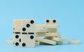 A stack of dominoes on a blue background, intellectual game