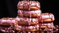 A stack of doughnuts with chocolate pink color background