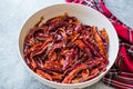 Stack of Dried Red Chili or Chilli Cayenne Pepper in Bowl Royalty Free Stock Photo