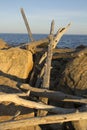 Stack of driftwood among rocks of Hammonasset Beach, Connecticut Royalty Free Stock Photo