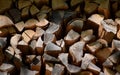 Stack of dry chopped firewood logs. Wooden background Royalty Free Stock Photo