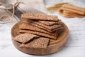 Stack of dry rye crispbreads on white wooden table Royalty Free Stock Photo