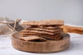 Stack of dry rye crispbreads on white wooden table Royalty Free Stock Photo