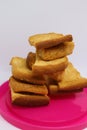 Stack of dry toast on Plastics plate. Close Up Pile of toasted bread slices. Toast loaf on white background Royalty Free Stock Photo