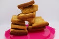 Stack of dry toast on Plastics plate. Close Up Pile of toasted bread slices. Toast loaf on white background Royalty Free Stock Photo