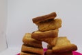 Stack of dry toast on Plastics plate. Close Up Pile of toasted bread slices. Toast loaf on white background Royalty Free Stock Photo