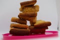 Stack of dry toast on Plastics plate. Close Up Pile of toasted bread slices. Toast loaf on white background Royalty Free Stock Photo