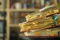 stack of dusty messy file folders with narrow depth of field, blurred office in the back,red tape, bureaucracy,aministration, Royalty Free Stock Photo