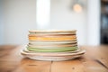 stack of earthenware plates with rustic glazes