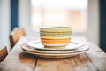 stack of earthenware plates with rustic glazes