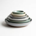 Stack of earthy toned ceramic bowls and plates Royalty Free Stock Photo