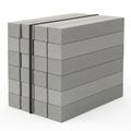 Stack of Gray Concrete Building Blocks Secured with Black Straps bricks construction Royalty Free Stock Photo