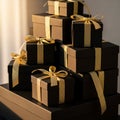 A stack of elegant black gift boxes adorned with shiny golden ribbons. Th Royalty Free Stock Photo