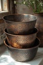 A stack of elegant copper pans and cups sat gracefully on a marble counter. Royalty Free Stock Photo