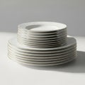 Stack of elegant white dinner plates with gold trim isolated on white background Royalty Free Stock Photo