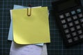 A stack of empty memo notes with payment receipt and calculator. Copy space for text, logo Royalty Free Stock Photo