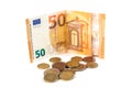 Stack of Euro banknotes and coins isolated. 50 Euro banknot Royalty Free Stock Photo