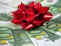 Stack of euro cash money and red bow background, money gift concept Royalty Free Stock Photo