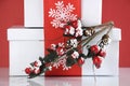 Stack of festive red and white theme Christmas gift boxes - closeup.