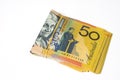 Stack of fifty Australian dollar bills on white background. Royalty Free Stock Photo