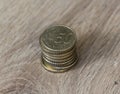 Stack of fifty euro cent coins on wooden background Royalty Free Stock Photo