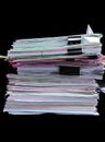 Stack of file folders, each filled with paperwork