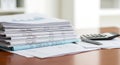 Stack of Financial Documents with Calculator Royalty Free Stock Photo