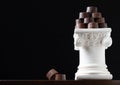 Stack of Fine Artisan Chocolates Stacked On White Pillar Column Royalty Free Stock Photo