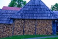 Stack of firewood, firewood, beautifully neatly stacked and sawn wood is stored in an open shed, Slovakia Royalty Free Stock Photo