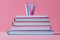 Colorful Pencils and Notebooks on Pink Background Royalty Free Stock Photo