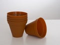 Stack of plastic flower pots on white background Royalty Free Stock Photo