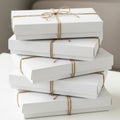 A stack of five rectangular white boxes tied with brown twine. The boxes are neatly Royalty Free Stock Photo