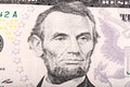 Stack of five U.S. Dollar. Close-up portrait of Abraham Lincoln. Royalty Free Stock Photo