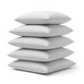 A stack of five white pillows neatly arranged against a white background Royalty Free Stock Photo