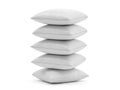 A stack of five white pillows neatly arranged against a white background. isolated on white background Royalty Free Stock Photo