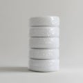 Stack of five white plastic bubble wrap rolls on white background, studio shot Royalty Free Stock Photo
