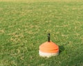Stack of flat marker cone in football field Royalty Free Stock Photo