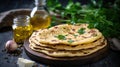 Stack of flatbreads arranged neatly on rustic wooden cutting board. Perfect for food-related Royalty Free Stock Photo