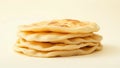 A stack of flatbreads on a plain background showing the texture and color of the freshly baked bread Royalty Free Stock Photo