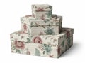 Stack of floral patterned gift boxes in varying sizes Royalty Free Stock Photo