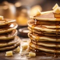 A stack of fluffy and golden pancakes with a pat of melting butter1