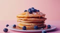 A stack of fluffy pancakes drizzled with sticky syrup and dotted with fresh blueberries providing a mouthwatering start Royalty Free Stock Photo