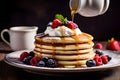 Stack fluffy pancakes topped with syrup, berries, and a dollop of whipped cream. Morning vibes for sweet food lovers