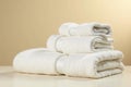 A stack of fluffy, white bath towels neatly folded, ready for use, showcasing luxurious softness and cleanliness. Generative AI Royalty Free Stock Photo