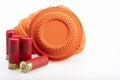 Stack of flying clay pigeon targets and shotgun shell bullets on white background , Gun shooting game