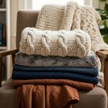 The top blanket is a cream-colored, chunky knit with a cable pattern Royalty Free Stock Photo
